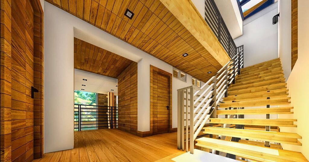 Modern home interior featuring custom millwork with natural wood paneling on walls and ceilings, a sleek floating staircase with metal railings, and matching wood doors—showcasing craftsmanship and design services from Spearfish Building Supply.