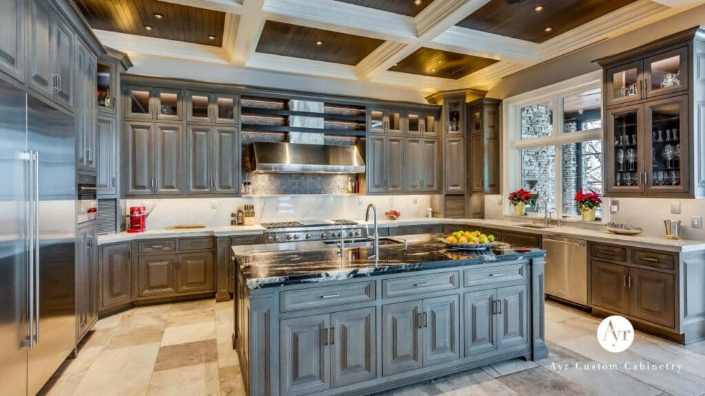 Luxury kitchen featuring high-quality custom cabinetry with rich wood finishes and modern stainless steel appliances—cabinetry provided by Spearfish Building Supply in Spearfish, SD.